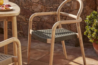 Silhouette image of people dance in disco night club to music from DJ on stage . New year night party and nightlife concept .