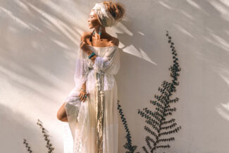 Silhouette image of people dance in disco night club to music from DJ on stage . New year night party and nightlife concept .